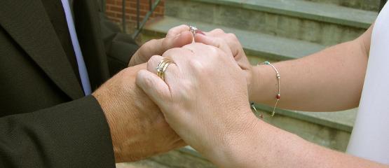 Two people holding hands