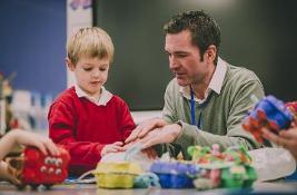 Man playing with child