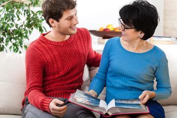 Man and woman looking at photo album