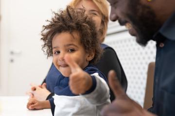 Little boy with his thumb up