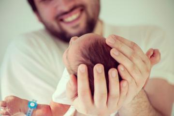 Father holding his newborn baby