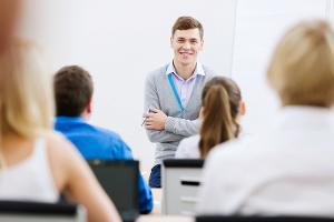 Man standing in front of a group of people