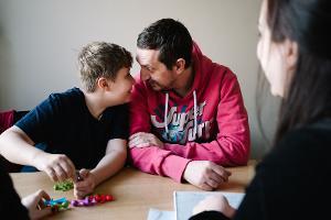 Social worker with parent and child