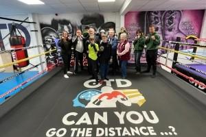 Group of people inside a boxing ring