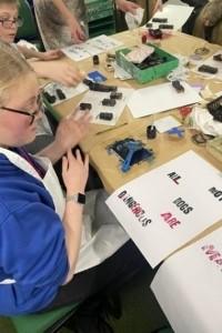 Young person creating a collage