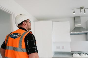 Durham County Council Building Control Officer surveying work in a kitchen