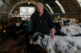 Female farmer with cows