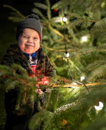 Roman Williams pressed the button to light up both the Christmas tree at County Hall and a nearby roundabout